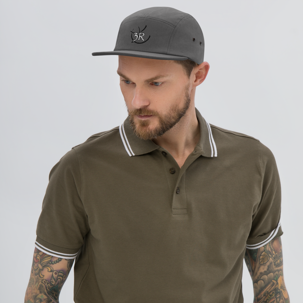 THR33 RINGS double-embroidered five-panel cap — man wearing grey cap, front lifestyle view