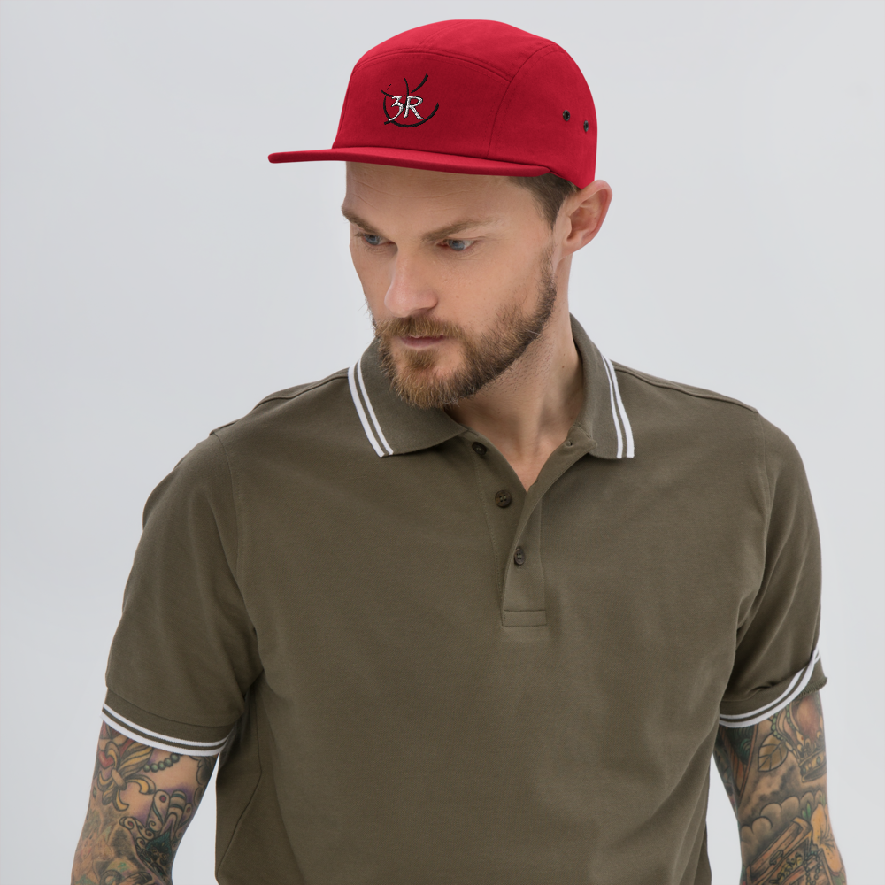 THR33 RINGS double-embroidered five-panel cap — man wearing red cap, front lifestyle view